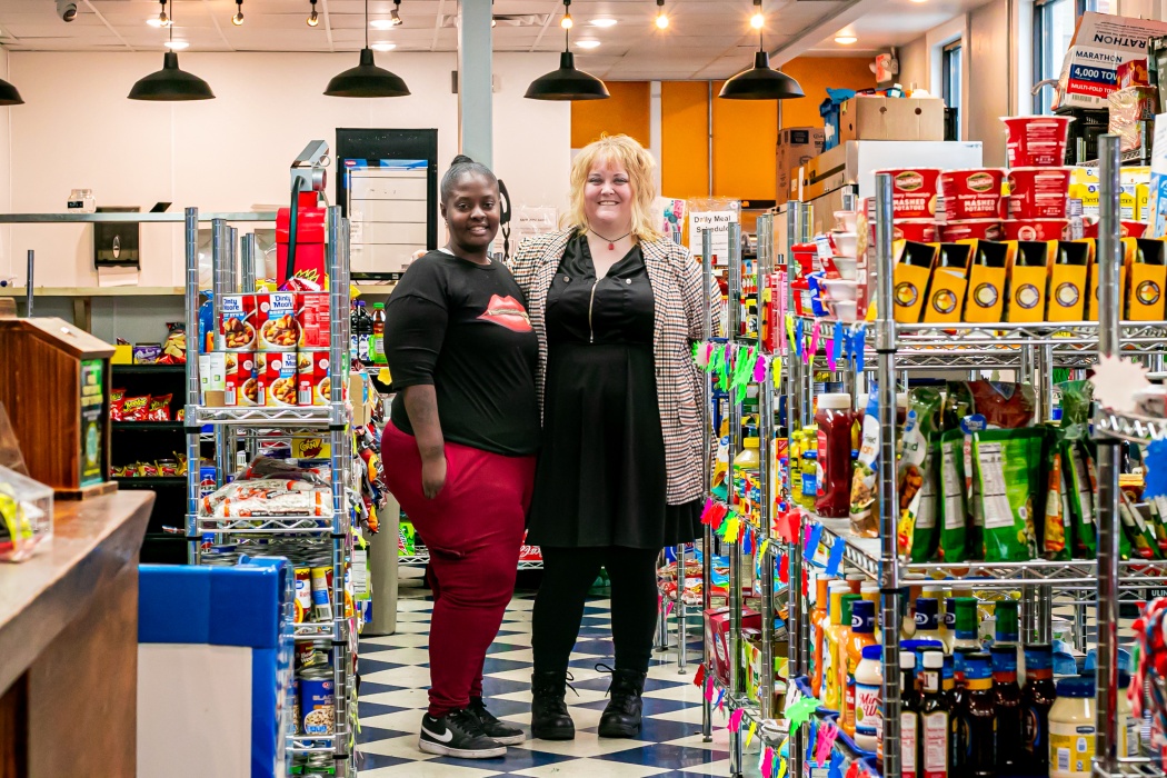 Women standing in Your Store of the Queen City