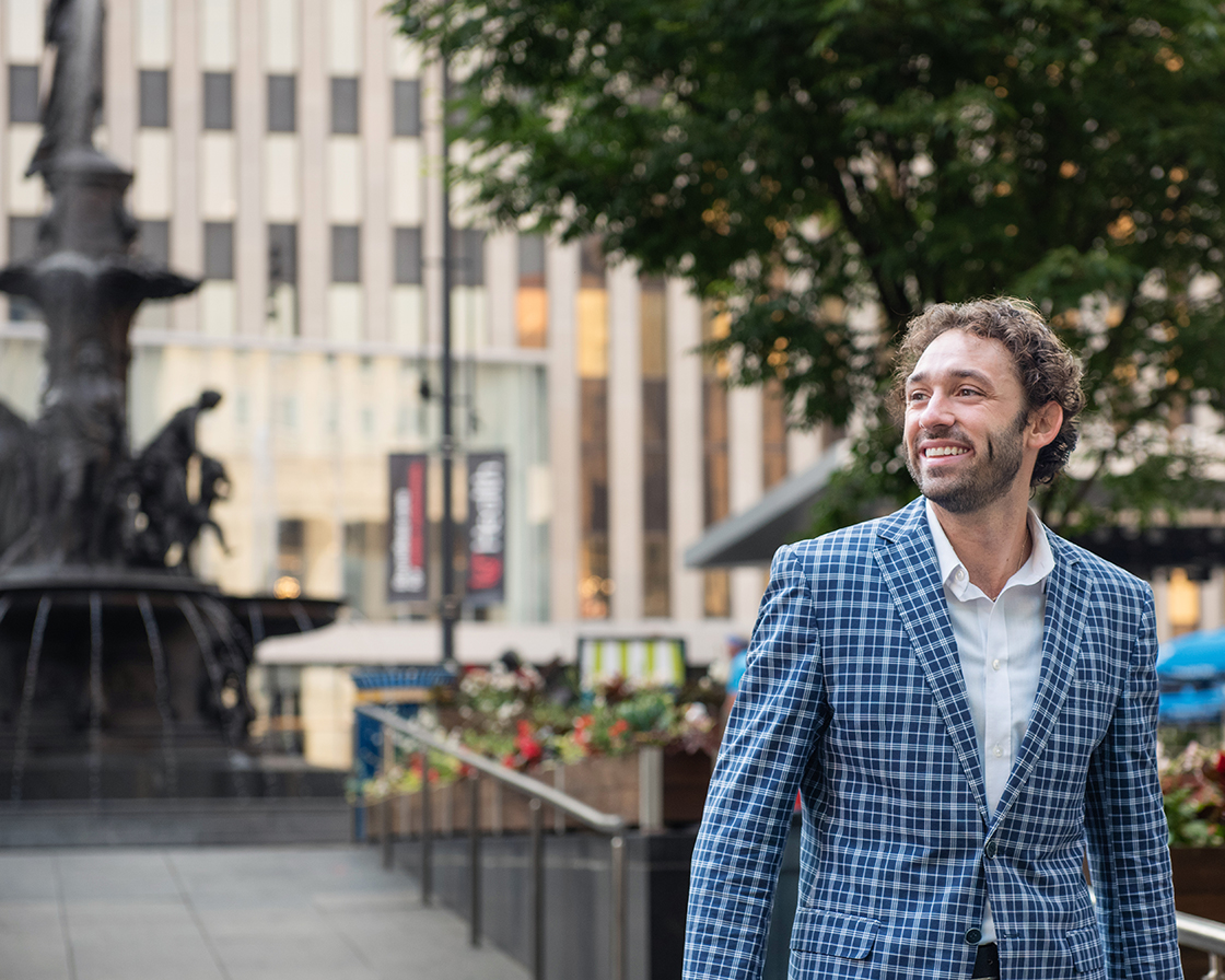 Man in suite at Fountain Square