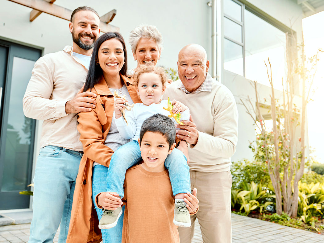 A multigenerational family stands together.