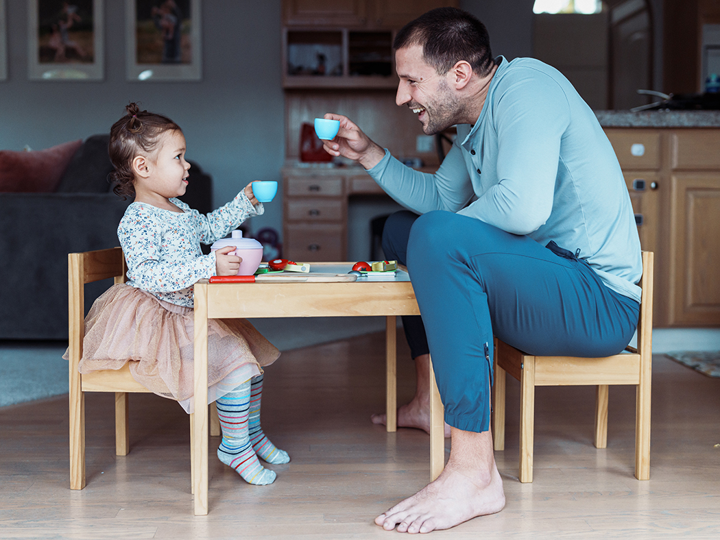 Dad and child having a tea party