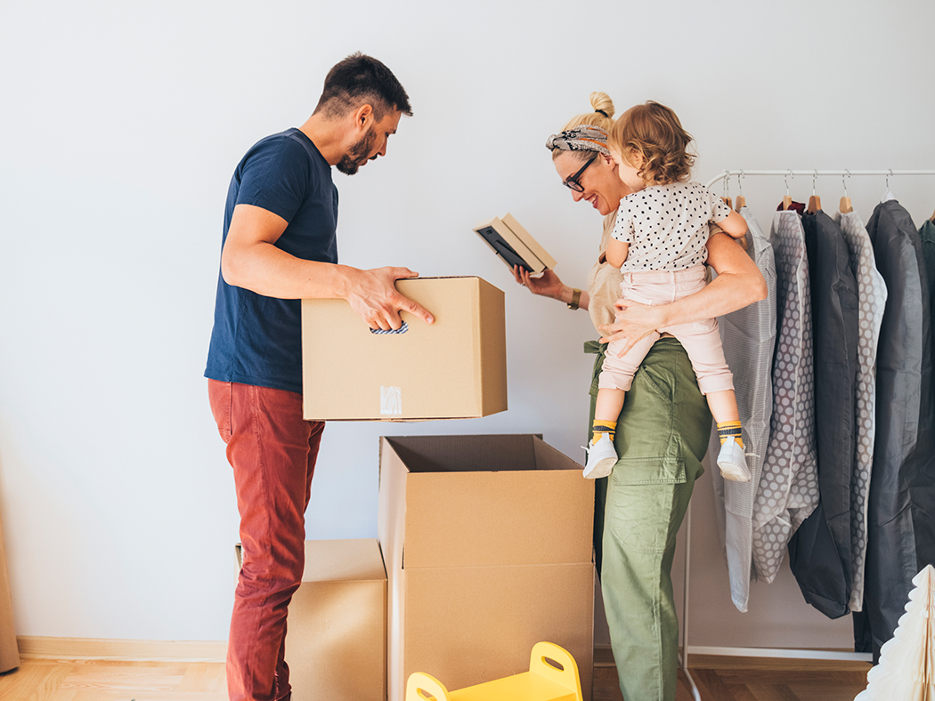 Family unpacking boxes