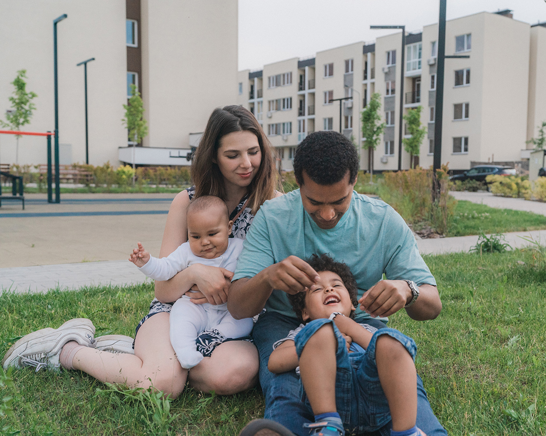 Family in front of apartments